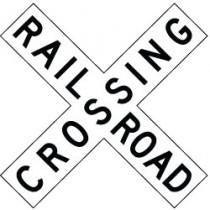 Railroad crossing sign with 'RAILROAD CROSSING' text.