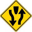 Yield sign with black arrows on a yellow background
