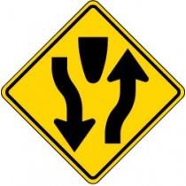 Yield sign with black arrows on a yellow background