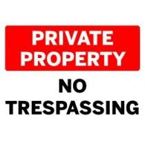 Red and white 'Private Property No Trespassing' sign on a black background