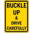 Yellow sign with black text 'Buckle Up & Drive Carefully'
