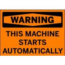 Orange warning sign with black text 'WARNING: This machine starts automatically' on a white background
