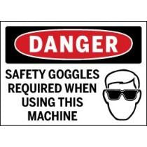 Safety sign with 'Danger' and 'Safety Goggles Required' text, featuring a graphic of a person wearing goggles.