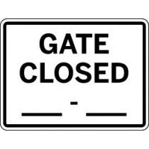 Gate closed sign with black text on a white background