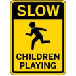 Yellow sign with black text and icon of a child running, indicating 'Slow Children Playing'.