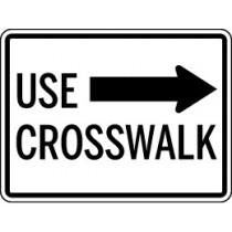 Traffic sign indicating 'Use Crosswalk' with an arrow pointing right.