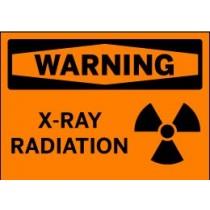 Warning sign for X-ray radiation with an orange background and black text and symbol.