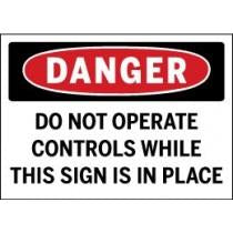 Danger sign warning 'Do not operate controls while this sign is in place'.