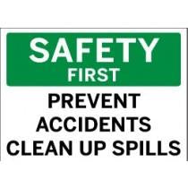 Safety sign with text 'Safety First, Prevent Accidents, Clean Up Spills' on a green and white background