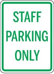 Staff parking only sign with green text on a white background