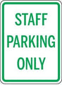 Staff parking only sign with green text on a white background