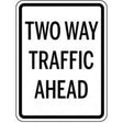 Two way traffic ahead sign with black text on a white background