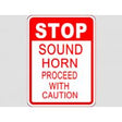 Sign with text 'STOP Sound Horn Proceed with Caution' on a white background