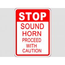 Sign with text 'STOP Sound Horn Proceed with Caution' on a white background