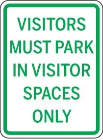 Sign indicating visitors must park in visitor spaces only.