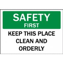 Safety sign with text 'SAFETY FIRST KEEP THIS PLACE CLEAN AND ORDERLY' on a green and white background