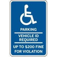 Handicap parking sign with text about vehicle ID requirement and fines.