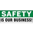 Safety slogan 'Safety is our business!' on a green and white background