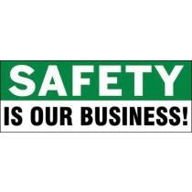Safety slogan 'Safety is our business!' on a green and white background