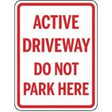 Sign indicating 'Active Driveway Do Not Park Here' with red text on a white background