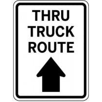 Traffic sign indicating 'Thru Truck Route' with an arrow pointing upwards.