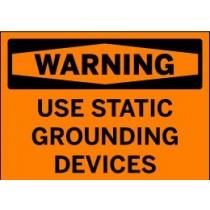 Warning sign with text 'USE STATIC GROUNDING DEVICES' on an orange background