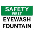 Safety sign indicating 'Safety First Eyewash Fountain' with green and white background.