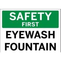 Safety sign indicating 'Safety First Eyewash Fountain' with green and white background.