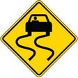 Yellow traffic sign with a black car icon and wavy line on a white background
