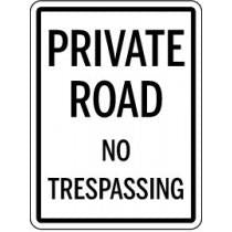 Sign with 'Private Road No Trespassing' text on a white background