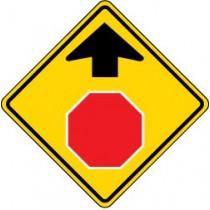 Road sign with a red stop symbol and black arrow on a yellow background