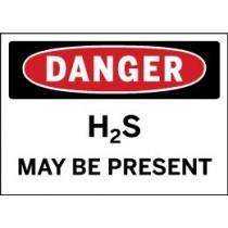 Safety sign warning of H2S presence with red border and black text.