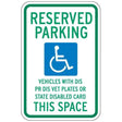 Reserved parking sign for disabled vehicles with wheelchair icon on a white background