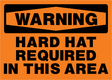 Warning sign with text 'Hard hat required in this area' on an orange background