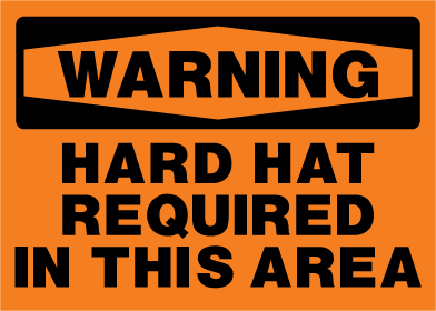 Warning sign with text 'Hard hat required in this area' on an orange background